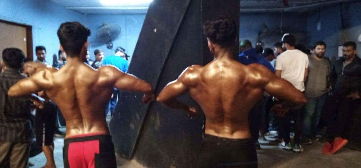 Bodybuilders training together at the gym